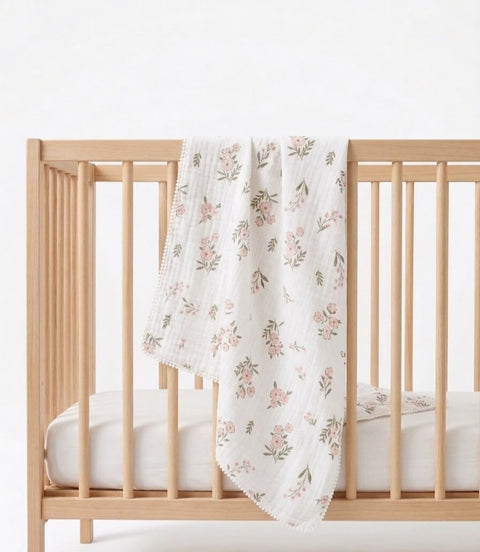 Petal and pom Muslin blanket