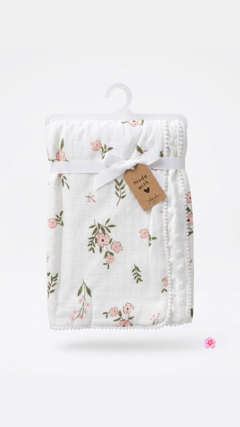 Petal and pom Muslin blanket