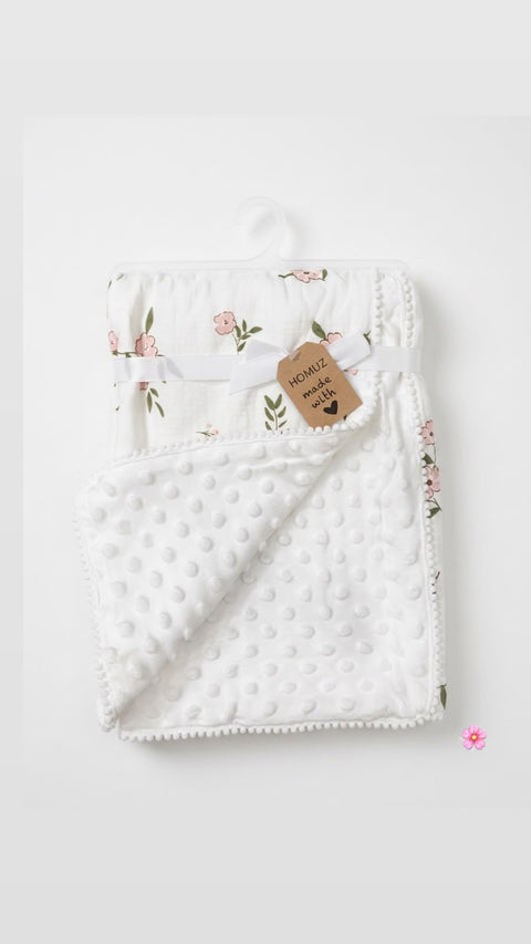 Petal and pom Muslin blanket